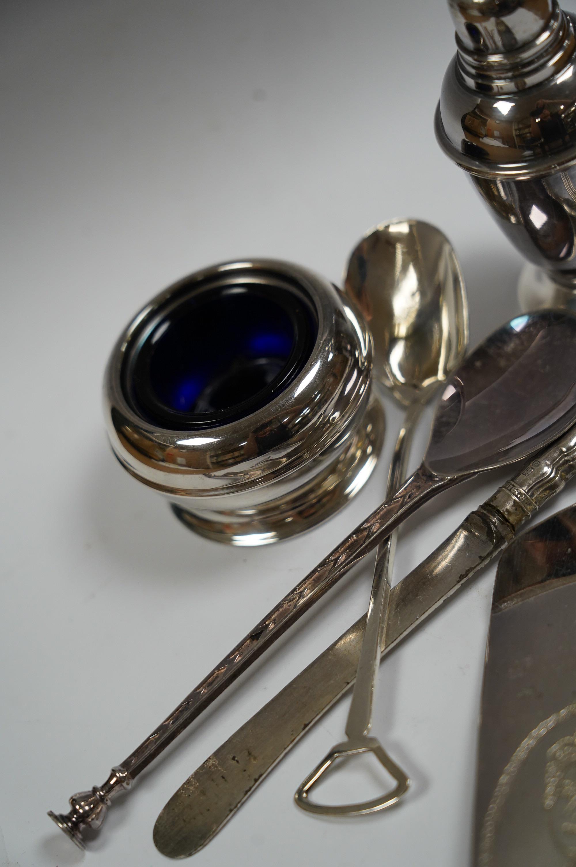 A small group of assorted teaspoons, condiment spoons, small servers, etc. including a Millennium seal top spoon by A. E. Jones Ltd and a Victorian shell bowl ladle by Jehoiada Alsop Rhodes and a silver thimble together